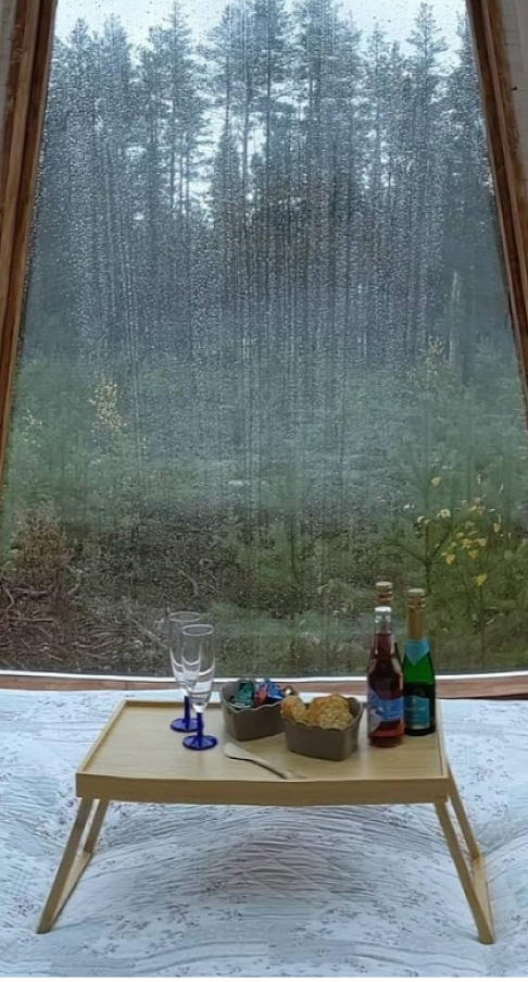 A tepee with the rain outside the tent